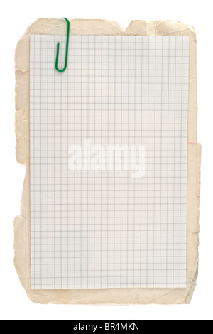 Checked notebook paper on old grungy cardboard background Stock Photo