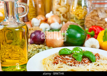 Spaghetti Bolognese with olive oil, Parmesan cheese, basil garnish various Italian pasta and ingredients Stock Photo