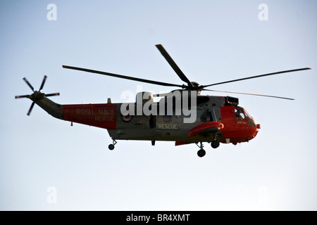 A Westland Sea King Royal Navy rescue helicopter in midair after taking off at Dundee airport,UK Stock Photo