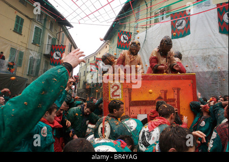 Ivrea Italy celebrates Carnivale with the Orange Battles when the town reenacts an ancient battle. Stock Photo