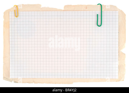Checked notebook paper on the old grungy cardboard background Stock Photo