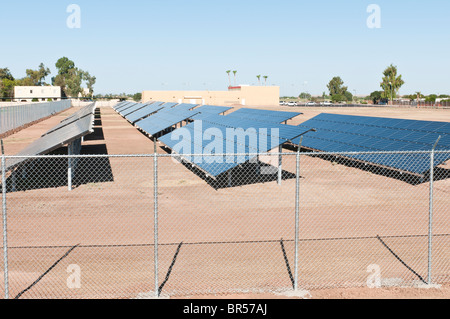 A solar farm is being constructed to supply electricity to an Elementary School in Arizona. Stock Photo