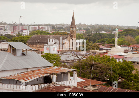 Stone Town, Zanzibar, Tanzania. Rooftops. St. Joseph's Catholic Church, Ibadhi Minaret on left, Sunni Minaret on Right. Stock Photo