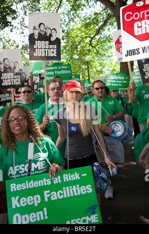 Members of the public employees union AFSCME rally against proposed cuts to social services and public facilities. Stock Photo