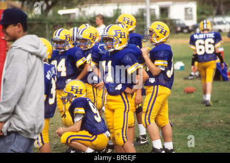 Pop Warner little league football youth helmet anticipate excitement Stock Photo