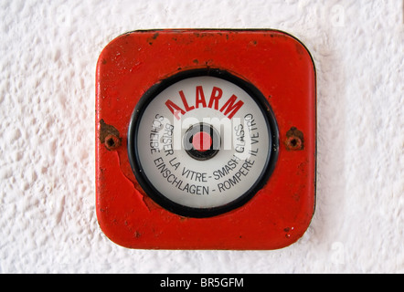 Old fire Alarm. In case of a fire break the glass and set the alarm. Stock Photo