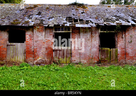 Derelict horse stables Stock Photo