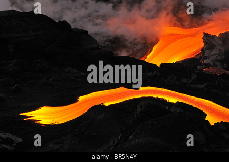 River of molten lava flowing to the sea, Kilauea Volcano, Hawaii Islands, United States Stock Photo