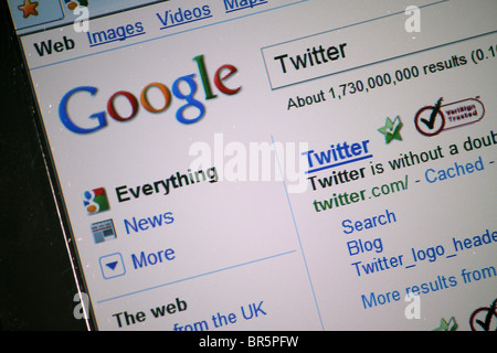 Searching the internet in Googles search engine for the Twitter social networking website; as displayed in the results Stock Photo