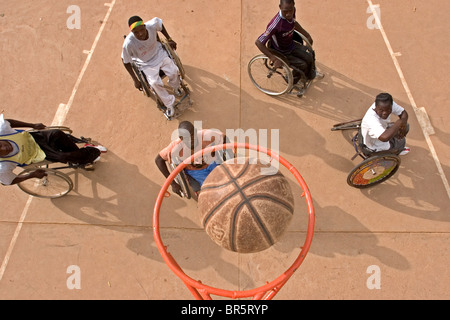 Competition is fierce during the wheelchair basketball training session in Burkina Faso. Stock Photo