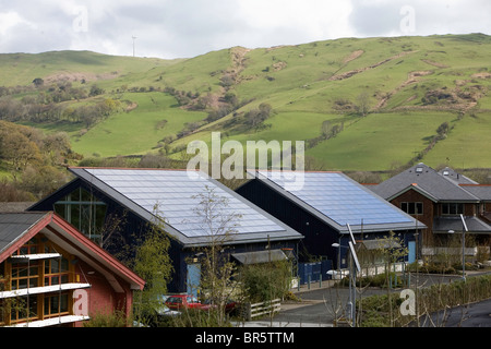 Roofs tiled with photovoltaic solar energy panels in Dyfi Eco Park, Machynlleth, Wales. Stock Photo