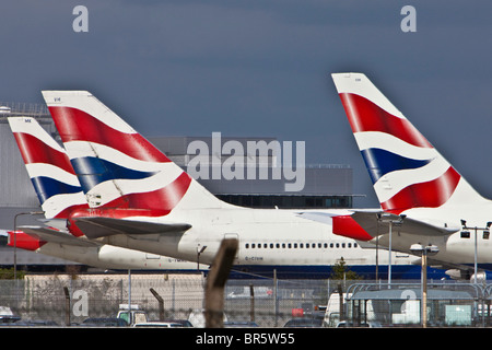 British Airways planes lined up at London’s Heathrow Airport. Stock Photo