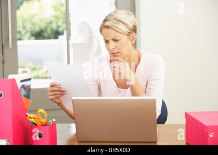 Woman Using Laptop At Home Stock Photo