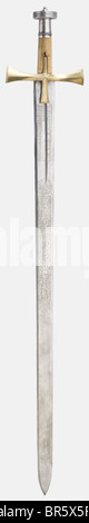 Ali Dinar ibn Zakariya, Sultan of the Sudan (1865 - 1916), a silver-mounted presentation sword (kaskara) for Salatin Basha, dated 1910 Massive double-edged blade with richly etched inscription cartouches on both sides, including two magic squares, Islamic religious texts, three poems, and a long inscription to the effect that this sword was a gift from Sultan Ali Dinar to Salatin Basha in 1328 (= 1910). Massive brass quillons with finely engraved tughras on the finials bearing the names 'Ali Dinar' and 'Salatin Basha in 1328' respectively. Round wooden grip wit, Stock Photo