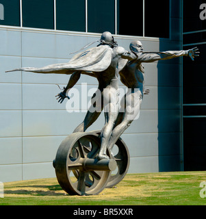 'The Chase' cast stainless steel sculpture in front of the Barber Vintage Motorsports Museum in Birmingham, Alabama, USA Stock Photo