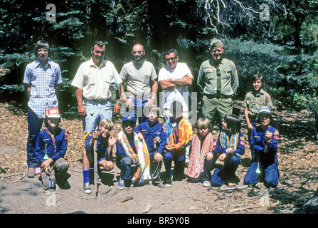 cub boy scout father group camp forest hike fun trail friend pal learn experience role model support teach demonstrate show love Stock Photo