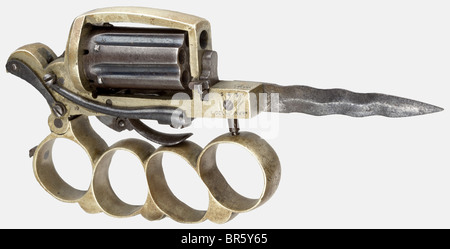 A rare Dolné patent 'Apache' knuckle-duster combination revolver, Dolné Type, circa 1875. In 5 mm pin-fire calibre. Serial number 545. 6-shot. The right side of the frame inscribed 'L. DOLNE INVur' and the front of the frame 'GB/SV*'. Double action combination weapon with a barrel group revolver, knuckle-duster, and a folding wavy edged dagger, 8 cm long. Folding trigger. Brass frame and brass knuckle-duster. The blued barrel group is detachable. Very rare and in good condition. Named for the so-called 'Apaches', a nickname for members of the Parisian underworl, Stock Photo