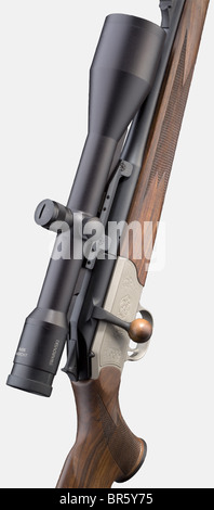 A repeating Blaser 'Stutzen' mod. R 93 with Habicht scope, 7 x 64 cal., no. 9/16751. Bright bore, barrel length 55 cm. Proof mark: 1995. Straight-pull bolt action. Trigger with encircled 'P' proof mark. Fixed sight. Bolt-handle knob made of precious wood. Complete anthracite finish. Grey, lightly engraved receiver. Hand-made walnut stock with cheek, pistol grip and chequering. Mounted: scope Swarovski Habicht 8 x 56, reticule 4A-I, eyepiece protection. New condition. Length 102 cm. Erwerbsscheinpflichtig. historic, historical, 1990s, 20th century, hunting weapo, Stock Photo