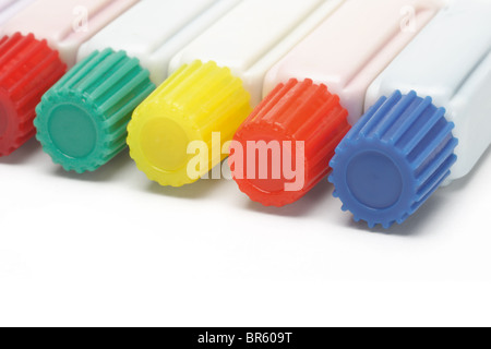 Tubes of multicolor paints lying on white background Stock Photo