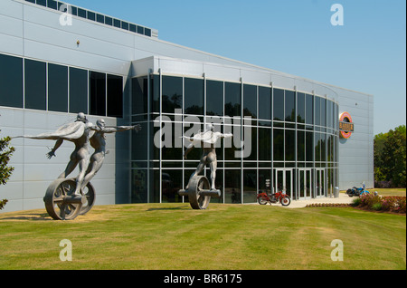 'The Chase' cast stainless steel sculpture in front of the Barber Vintage Motorsports Museum in Birmingham, Alabama, USA Stock Photo