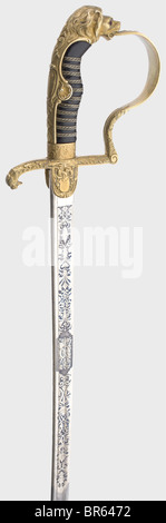 Generalmajor Hans Hüttner (1885 - 1956) - a sword awarded as a marksmanship prize, 1921, to the holder of the Knight's Cross. The Damascus pipe-back blade with yelmen is half nickel-plated and richly etched with vines and trophies against a blued background. Inscribed on the obverse side, 'Ehrenpreis für hervorrangende Schießleistungen 1921. Obltn. Hüttner I Rgt. 2.' (First Prize for Outstanding Marksmanship 1921. First Lieutenant Hüttner I Regt. 2), and on the back with the maker's inscription 'Weyersberg, Kirschbaum & Cie, Solingen' and the Bavarian proof mar, Stock Photo