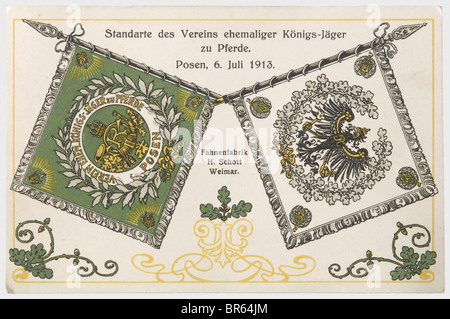 An association banner for veterans, of the Royal Mounted 'Jägers', Posen. Green silk with gold embroidery, displaying a hunting horn with a cipher surrounded by a laurel wreath, and crowns in the corners. The back is of white silk displaying a Prussian eagle in an oak leaf wreath with the 'WR' cipher in the corners. Dimensions 110 x 106 cm. Surrounded by silver fringe. The attachment loops have been replaced. On the top half of the pole a brass finial displaying the monarch's cipher. Length of the pole 180 cm. Also a picture postcard showing the presentation of, Stock Photo