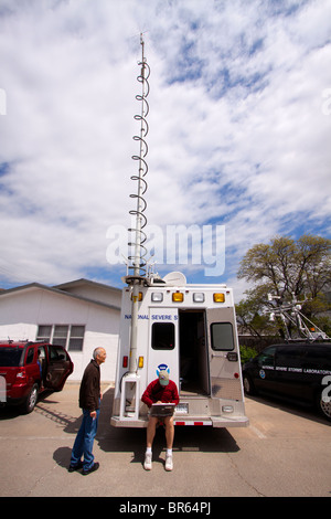 Two meteorologists study data at the National Severe Storms Laboratory mobile field command in Kansas, May 6, 2010. Stock Photo