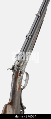 A hammer rifle/shotgun combination 'Nowotny in Prag' with scope, circa 1891, 5.6 x 35R/410 cal. (12 mm), no. 5995. Matt bores, barrel lengths 63 cm. German supply mark crown/'V'. Barrel rib with fixed sight, one flap missing, bead front sight. Folding diopter. Greener bolt. Ejector. Double trigger, front one with set trigger. On barrel rib signed in gold 'J. NOWOTNY BÜCHSENMACHER IN PRAG', also gilded oak leaves at barrel root. Complete bluing of barrels. Light, back-action locks, hammers and system decorated with oak leaves and plenty of red deer in relief and, Stock Photo