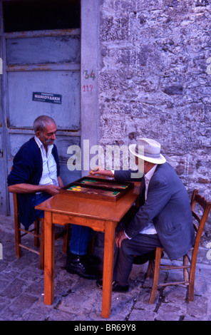 One of the most popular boardgames in the Mediterranean is Tavli. Seems to be for the men only. I have never seen women playing Stock Photo