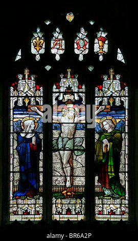 Stained glass window by Joseph Wippell & Co depicting The Crucifixion, St Helena's church, Helland, Cornwall Stock Photo