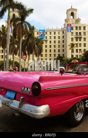 A classic American car being used as a taxi parked outside the Hotel Nacional in Havana Cuba Stock Photo