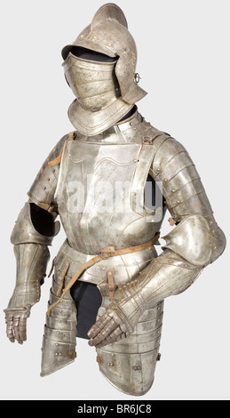 A German suit of armour for a man at arms, circa 1580. Assembled from old pieces. Visor and vambraces are Historismus Period replacements. Burgonet with a two-piece skull and high comb with rolled edge, riveted visor and neck guard, and attached cheek pieces with perforations. Surrounded by brass lining rivets. Three-piece, laminated closeable visor. Hinged bevor with a two-piece gorget and a massive turned under and corded flange. Pauldrons of six lames attached. Full cannons of the vambrace with closed couters. Slightly different fingered gauntlets, missing t, Stock Photo