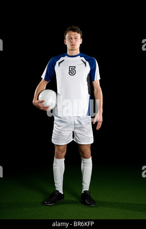A soccer player, portrait, studio shot Stock Photo