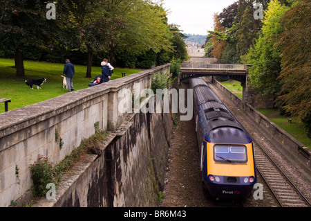 A First Great Western train passes through a cutting in Sydney gardens in the city of Bath Stock Photo