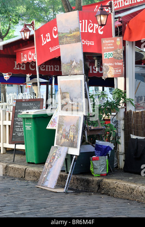 French Artist's painting on display in  the market in the Montmartre district, in Paris, France. Stock Photo