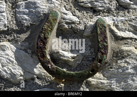 Wall mounted rusty Iron Horseshoe Stock Photo