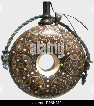 A German powder flask with bone and brass inlays, circa 1600. Turned wooden body with a bone ring set in the centre. Richly inlaid on both sides with wood, bone pins, and circles of brass wire. Wooden spout with a spring-loaded iron closure. Replacement spring. Later carrying cord. Diameter 11 cm. historic, historical, 17th century, powder flask, accessory, accessories, military, militaria, object, objects, stills, utilities, utility, clipping, clippings, cut out, cut-out, cut-outs, utensil, piece of equipment, utensils, Stock Photo