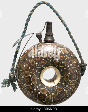 A German powder flask with bone and brass inlays, circa 1600. Turned wooden body with a bone ring set in the centre. Richly inlaid on both sides with wood, bone pins, and circles of brass wire. Wooden spout with a spring-loaded iron closure. Replacement spring. Later carrying cord. Diameter 11 cm. historic, historical, 17th century, powder flask, accessory, accessories, military, militaria, object, objects, stills, utilities, utility, clipping, clippings, cut out, cut-out, cut-outs, utensil, piece of equipment, utensils, vessel, vessels, Stock Photo