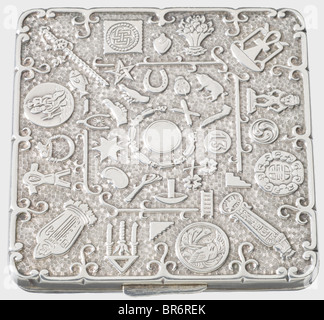 A silver cigarette case., The entire top and bottom side covered with signs of the zodiac and magical symbols in relief. Dimensions 75 x 75 mm, Weight 93 g, no marks. On the inside 18 engraved signatures, partly dated (1934 - 1940). Among them the aviators Gottfried Müller (DK), Joachim Müncheberg, Adolf Galland ('Dein Dolfo'), D.v. Massenbach, Gen. Otto v. Renz, etc. historic, historical, 1930s, 20th century, Air Force, branch of service, branches of service, armed service, armed services, military, militaria, air forces, object, objects, stills, clipping, cli, Stock Photo