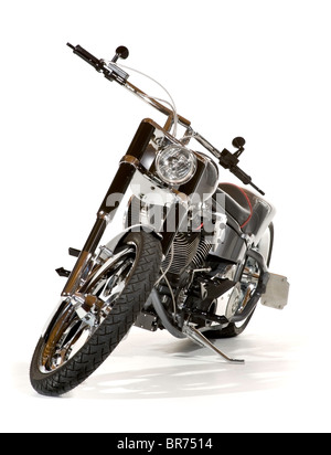 High end custom chopper motorcycle, seen from the front with handlebar and wheel turned toward the viewer. Isolated. Stock Photo