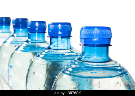 A row of bottles of water isolated on white Stock Photo