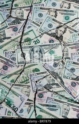 Cracked  American dollar bills concept to represent an economic crisis Stock Photo