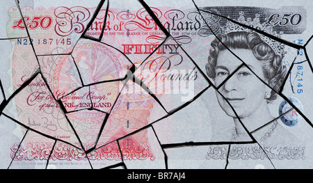Cracked fifty pound note concept to represent an economic crisis Stock Photo