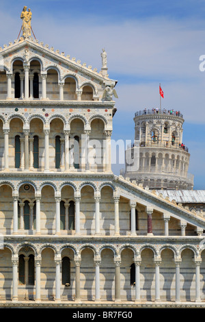 The Duomo with the iconic Leaning Tower behind it, in Pisa's Square of MIracles, Italy Stock Photo