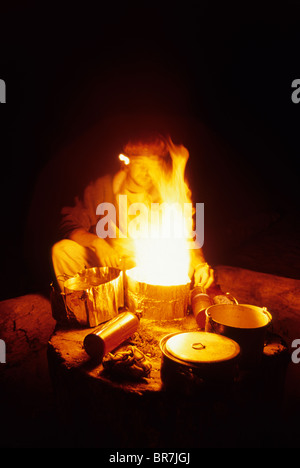 Man cooking on camp stove. Vargas Island British Columbia Canada Stock Photo