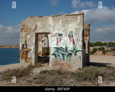 Graffiti on wall of derelict building Stock Photo