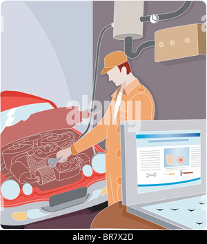 An auto mechanic using on-line instructions to tune up a car engine Stock Photo