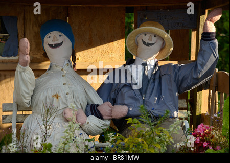 Scarecrow couple in garden Stock Photo