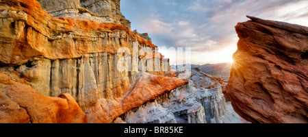 Puffy clouds and colorful sandstone rocks at Red Rock Canyon State Park, California Stock Photo