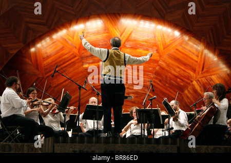 Charles Ansbacher conducts the Boston Landmarks Orchestra during an outdoor summer concert at the Hatch Shell in Boston Stock Photo